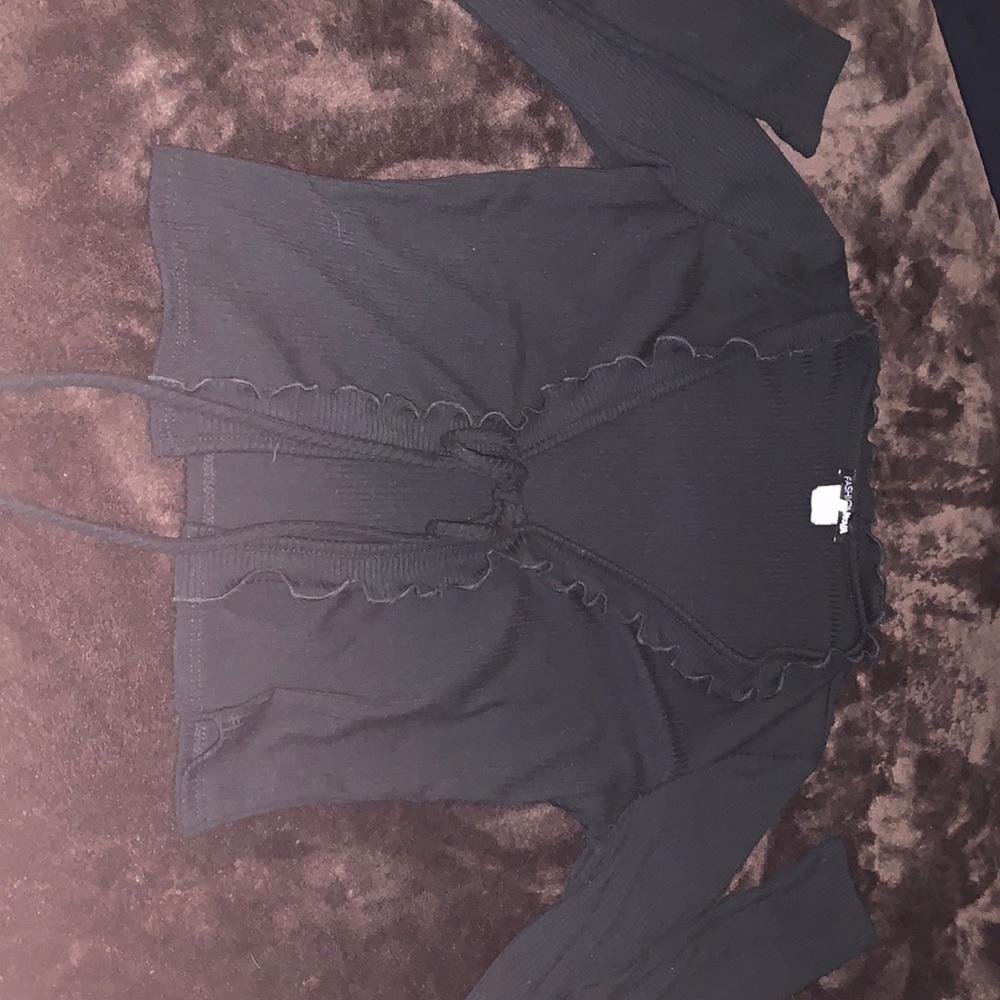 black, long sleeve, ruffles, cropped with tie in the front.